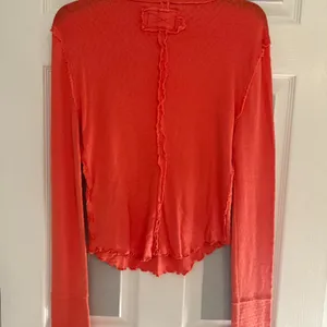 Free People We The Free Sarah Pointelle Turtleneck in red . NWOT, size medium . thumbnail 4