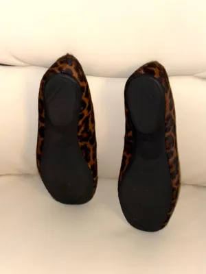 The shoes are Gentle Souls flats with a leopard print and a calfskin finish. thumbnail 6
