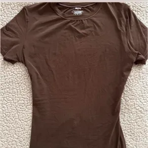 brown skims fits everybody tshirt thumbnail 1