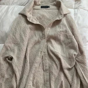 Textured oversized loose fitting button down shirt  thumbnail 1