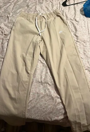 Men’s Nike woven tapered pants thumbnail 1