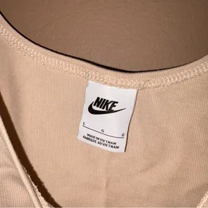 Nike Cropped Flowy‎ Embroidered Swoosh Active Tank Tan Beige large thumbnail 3