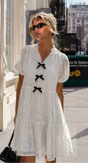 CeCe White Lace Tiered Mini Dress with Black Bow Details thumbnail 1