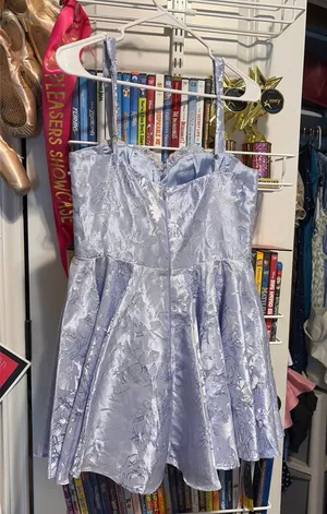 A light blue, lace looking, short dress. thumbnail 1