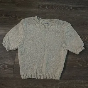 Knitted cream tee shirt in size small thumbnail 1