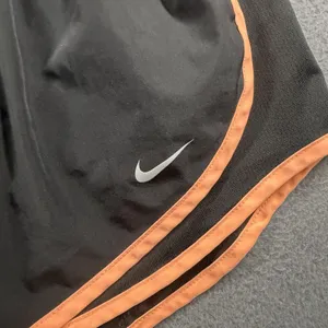 Nike Dri-FIT Running Shorts Womens Medium Black Orange Elastic Waist 3" Inseam thumbnail 2