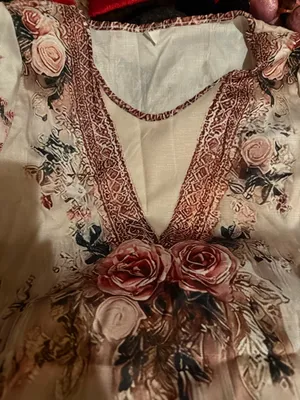 Elegant blush pink floral maxi dress with a V-neck and soft flowing fabric. Features romantic rose print and subtle lace-trim detail at the neckline. Lightweight and feminine for day or evening wear. Blush pink color complements neutral accessories. thumbnail 4