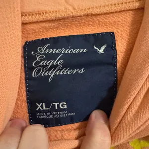 American Eagle Outfitters Peach Hoodie with Yellow Graphic thumbnail 2
