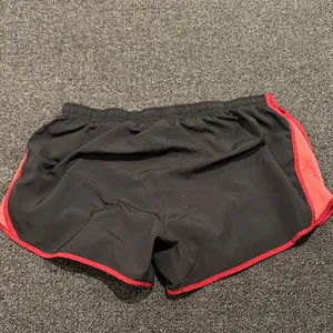 Nike Women's Athletic Shorts in Black and Red thumbnail 6