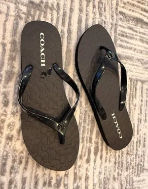 NEW Coach women's size 10 (40) black Abbigal turn-lock flip flops thumbnail 1