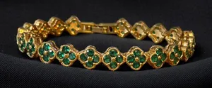 Gold tone emerald clovers tennis bracelet thumbnail 1