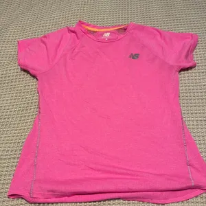 New Balance women’s running shirt. Size medium thumbnail 1