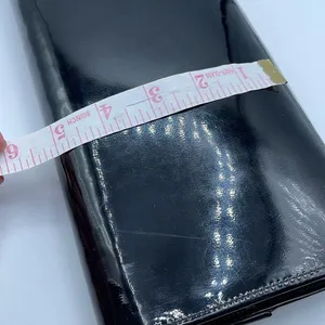 Black faux patent leather clutch with wave design on front. thumbnail 8