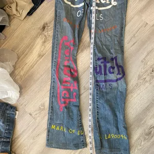 hand painted logo graphic jeans thumbnail 4