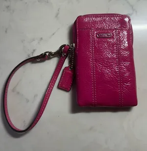 Coach Patent Leather Wristlet in Vibrant Magenta thumbnail 1