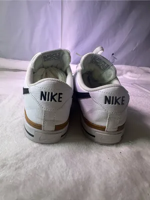 Nike White Sneakers with Black Swoosh and Orange Accent thumbnail 7