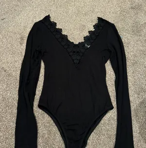 Brandy Melville Black Long Sleeve Bodysuit thumbnail 1