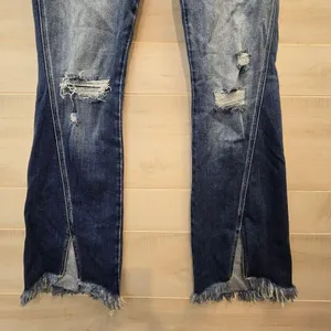 {29} KanCan Distressed Blue Jean Split Flare Hem Fringe Detail thumbnail 5