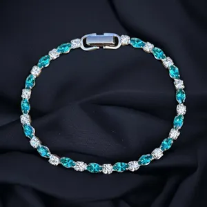 Silver tone teal and clear tennis bracelet thumbnail 1