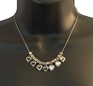Silver tone dangling hearts charm necklace thumbnail 1