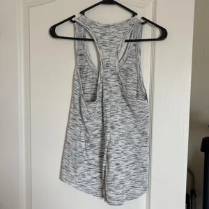 Lululemon black and white racer back tank. Can tie in the the back. thumbnail 2