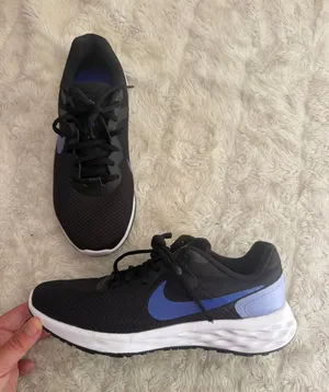 Nike Women's Revolution 6 Next Nature in Black and Lavender size 8.5 thumbnail 1