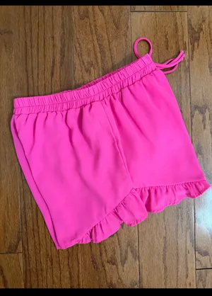 Hot Pink flowy ruffle-hem shorts with elastic drawstring & lightweight - Size M. relaxed design. Gently warn and excellent condition. Measurements approximately 12” waste, not fully stretched out x 12” long. Non-smoking home. priced to sell at as is condition. Don’t like my price, make reasonable offer! And thank you for checking my closet. thumbnail 2