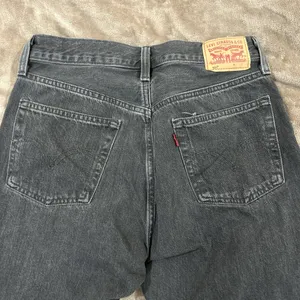 Levi’s 501 black raw hem jeans button fly 27/30 thumbnail 3