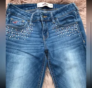 Hollister embellished light wash skinny jeans. Size 3. They are skinny. Have studs/bling around front pockets. They are new. thumbnail 2