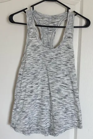 Lululemon black and white racer back tank. Can tie in the the back. thumbnail 1