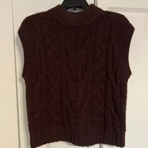 Cable Knit Sleeveless Turtleneck Sweater in Dark Brown thumbnail 1