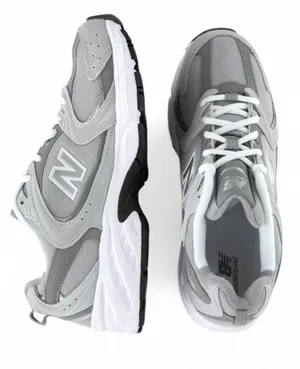 New Balance Woman's Grey and White Athletic Sneakers thumbnail 1