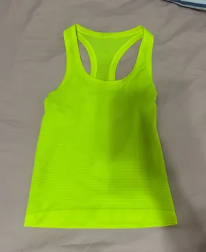 Lululemon neon green tank top #activewear #athletic marks shown on last pic thumbnail 1
