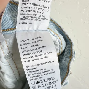 Levi's | 501 Original 100%‎ Cotton Cut Off Raw Hem Jean Shorts in Medium Blue thumbnail 6