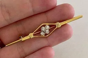 gold colored pin with Rhine stone detail thumbnail 1