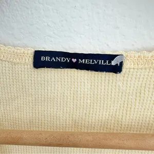 yellow Brandy Melville tee with a cute criss-cross detail thumbnail 2