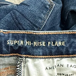 American Eagle Outfitters Size 0 Super Hi-Rise Flare Dark Blue Stretchy Jeans thumbnail 9