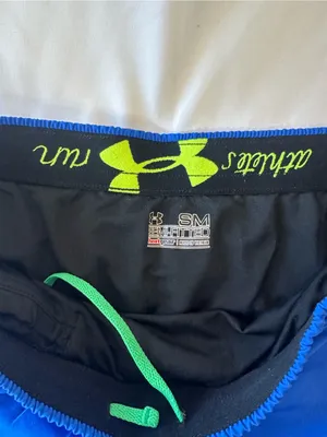 Under Armour Women’s Royal Blue Athletic Shorts with Green Accents thumbnail 2