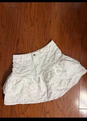 SHEIN ruffle trim skirt textured fabric with a tiered ruffles - size Medium. ***Refer to measurements. Beautiful skirt to wear out on a party trip. Fun & spunky. MOD jacquard ruffle trim skirt features a textured fabric with a tiered, ruffled hem and a button closure. Measurements approximately 15” waste x 16” long. Non- smoking home. priced to sell at as is condition. Don’t like my price, make reasonable offer! And thank you for checking my closet. thumbnail 3