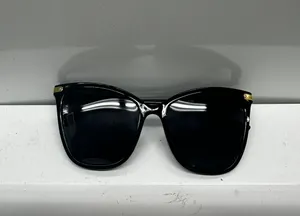 Stylish black sunglasses with gold accents. thumbnail 2
