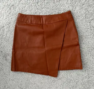Forever 21 Rust Faux Leather Asymmetrical Mini Skirt thumbnail 1