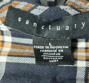 Classic Sanctuary navy plaid tunic-style button front shirt featuring a relaxed fit, chest pockets, and roll-tab sleeves for versatile styling. Lightweight and easy to wear with leggings, denim, or layered over a tank. Great casual staple for fall and transitional seasons thumbnail 7