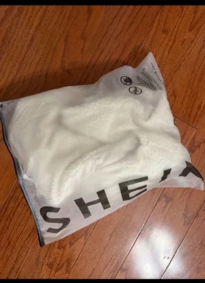 SHEIN Cream sherpa fleece fluffy puffer Zip up Vest with bag - size Medium. ***refer to measurements for size. Gently Warn and excellent condition. Measurements approximately from armpit to armpit 21” not fully stretched out x 22” long. Non-smoking home. Priced at as is condition. Don’t like my price make a reasonable offer! And thank you for checking my closet! thumbnail 6