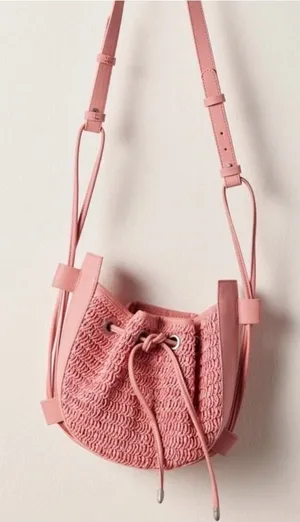 Free People Cabana Woven Drawstring Crossbody Bag in Pink thumbnail 1