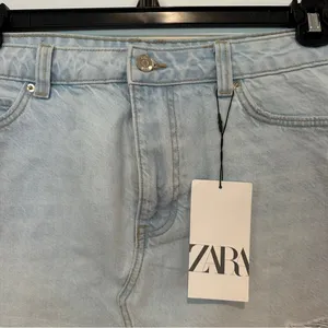 New Zara Ripped Denim Mini Skirt Sz L Distressed Hem Light Blue NWT thumbnail 7
