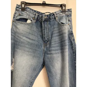 Petra 153 jeans w/ heavy knee destruction, whiskering, and a raw frayed hemline thumbnail 2