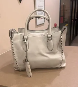 London Fog Cream Leather Tote with Tassel Accent thumbnail 1