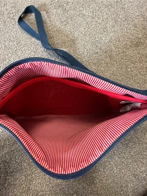 Herschel navy blue crossbody bag with red/white striped lining thumbnail 3