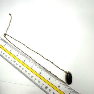 Black and gold tone pendant necklace thumbnail 7