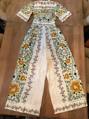 The Farm Rio Folk Floral Jumpsuit features a vibrant print with short sleeves, a V-neckline, and a relaxed, wide-leg silhouette. thumbnail 3